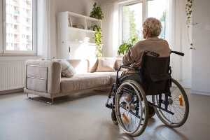 elderly woman left sitting alone in a wheelchair