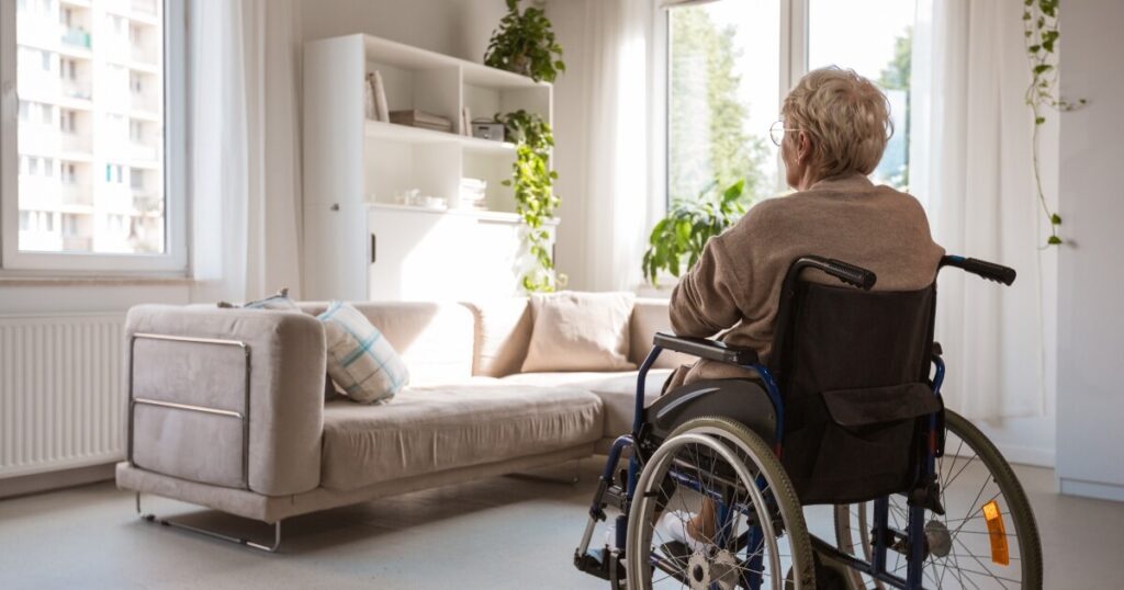 elderly woman left sitting alone in a wheelchair