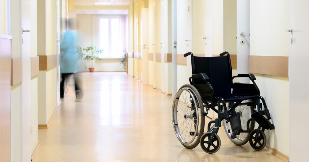 wheelchair left in empty memory care hallway