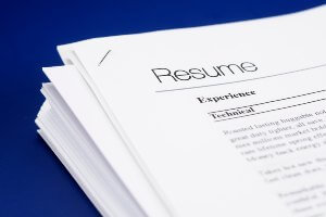 stack of resumes on desk