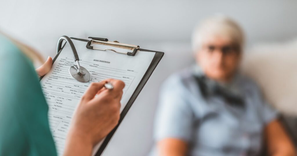 stock image of a health inspector questioning an elderly nursing home resident